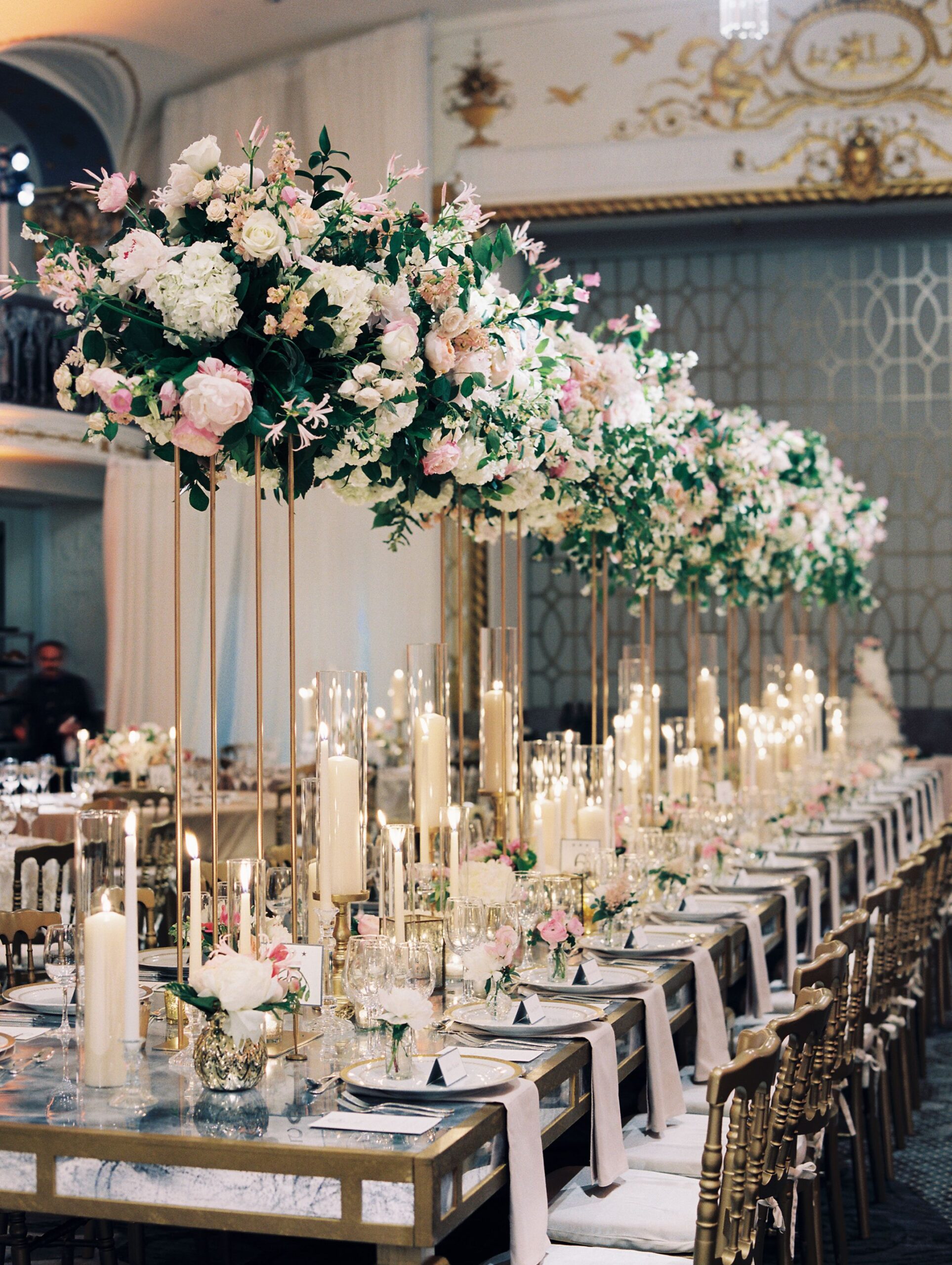 elegant wedding reception table setting with floral centerpieces