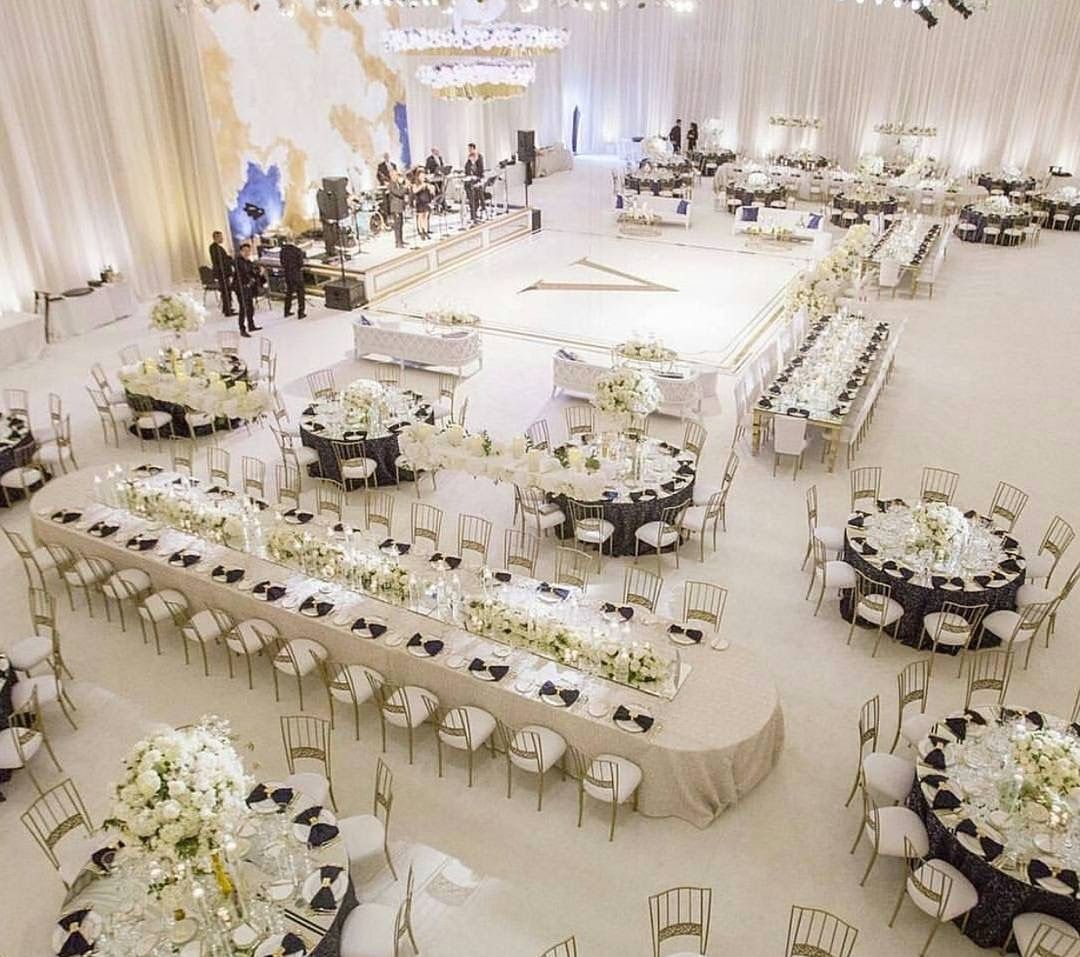 venue coordinator setting up reception tables