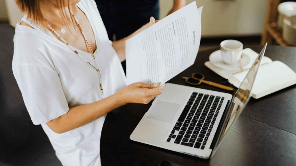 wedding planner reviewing client inquiries on laptop
