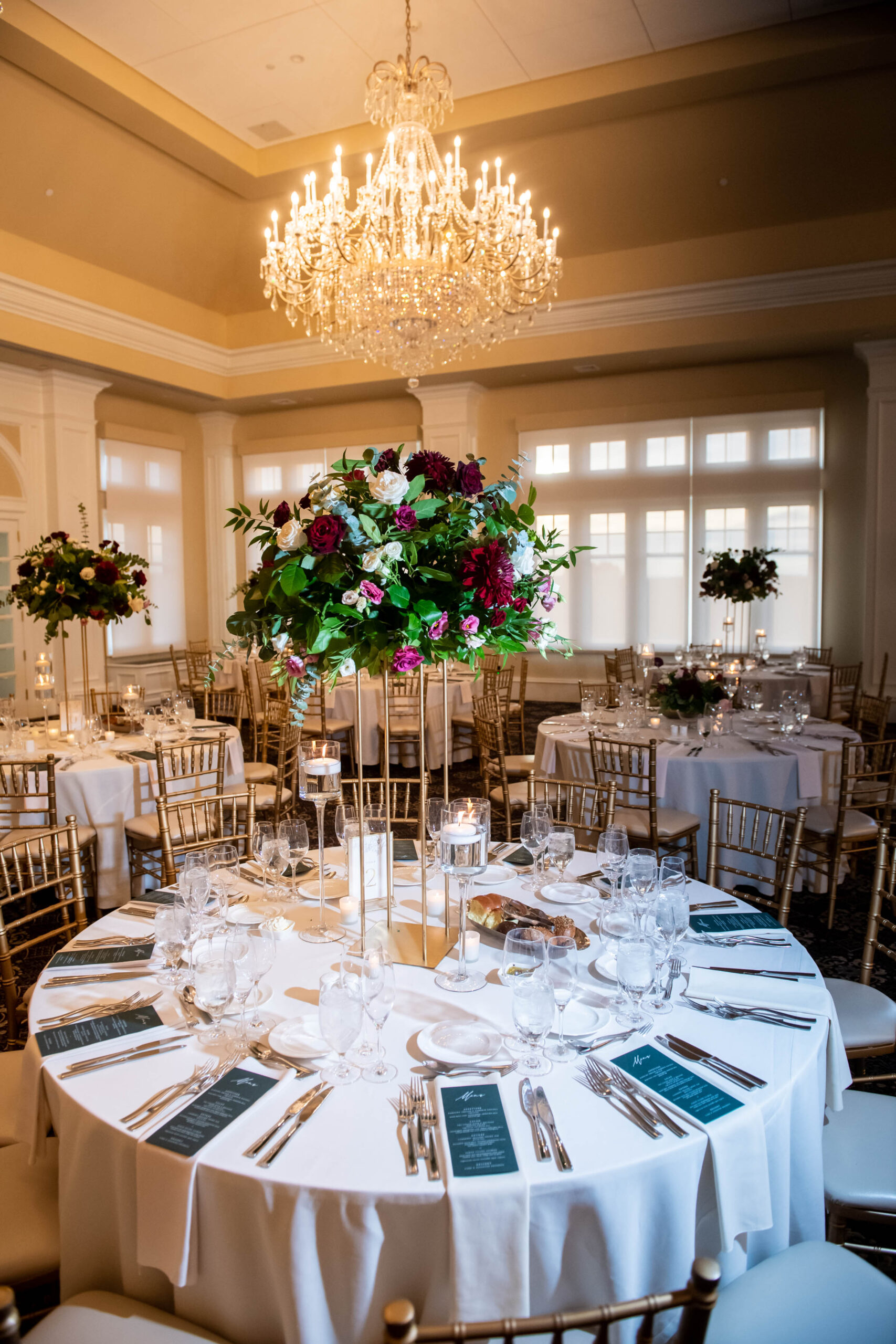 wedding planners setting up reception tables and centerpieces
