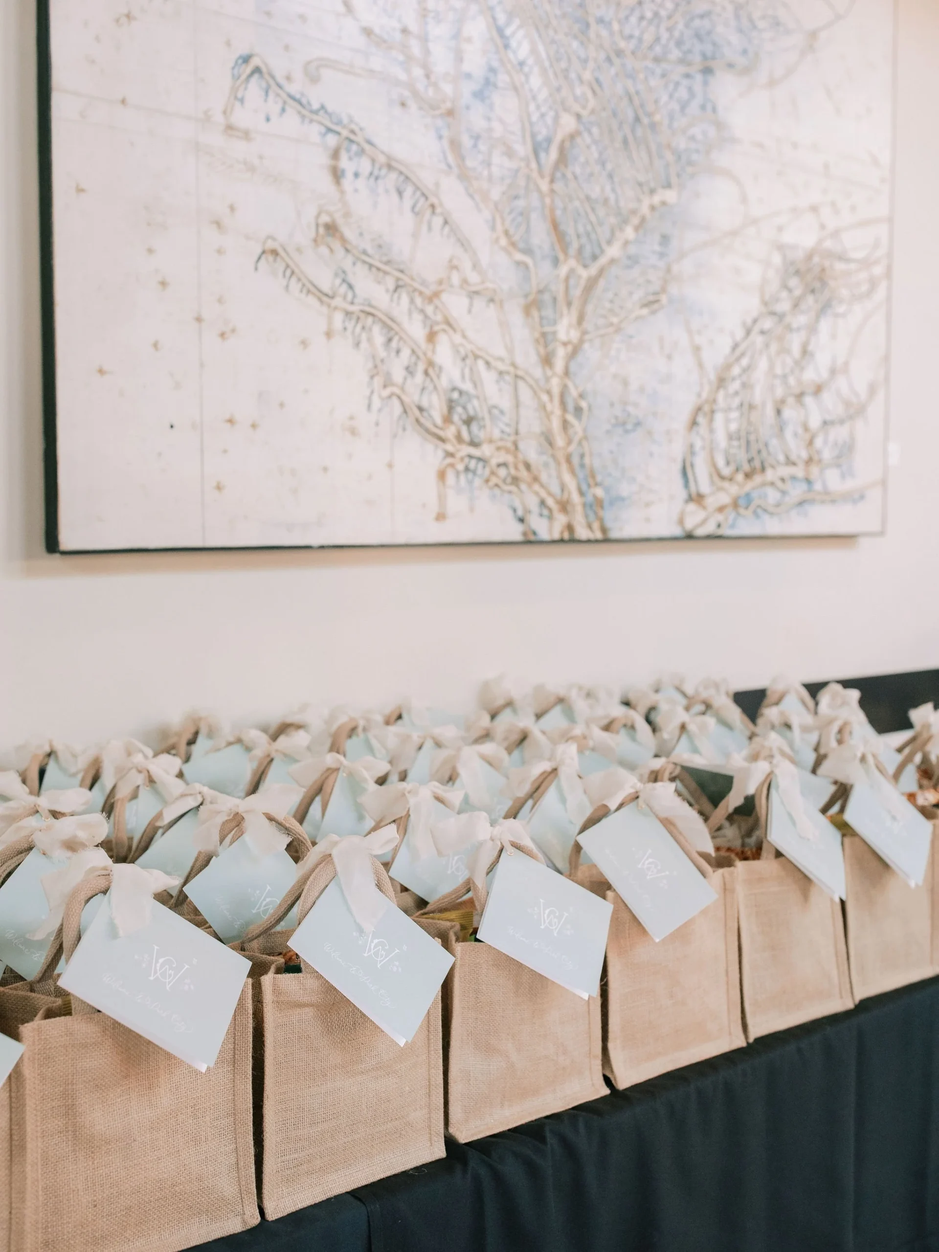 wedding planner organizing welcome bags on table